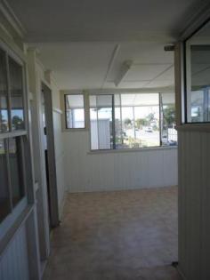 3 Victoria St Bundaberg East QLD 4670 Property ID: #2710527 QUEENSLANDER ON 1,012m2 INDUSTRIAL BLOCK 4 1 2 Zoning - Low Impact Industry. Live or rent the house, develop the back. Upper level of the Queenslander features 4 carpeted bedrooms, combined lounge and dining room. Front sunroom, separate kitchen with island bench. Separate toilet and bathroom, gas cooking and hotwater. Downstairs is laundry area, 2 storage area's or extra car spaces and fully concreted. Located next to Bundy Ice. Inspection Times Contact agent for details Land Size 1012 m2 Features •Secure Parking