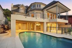 28 Albany Street Point Frederick NSW 2250 An extremely rare opportunity to purchase Albany street’s most iconic waterfront home, the ultimate in luxury and architecture. Be captivated by this alluring residence from the moment you enter. Exquisitely finished with a neutral palette and high quality appointments. This magnificent home is spread over 1157 sqm of prime waterfront land. One of only a few properties in Point Frederick featuring lift access to all 3 levels of the home. The seamless indoor/outdoor living and dining is designed to make the most of its waterfront position, with functionality and family lifestyle in mind. - 5 double sized bedrooms, 3 with ensuites - Boatshed with boat ramp, jetty and mooring - Purpose built home cinema - Saltwater inground pool - Extensive use of Travertine and Canadian Maple floors - Soaring ceilings and luxury fittings - 3 separate living areas - Marble bathrooms - Lighting control system - Aiphone communications to all floors - Computer operated security system incorporating video surveillance - Potential for self contained area above the 4 car garage - Ramp access Entertaining friends and family with the amazing backdrop of Brisbane Water will be a treat. This is an exceptional position in Point Frederick’s most prestigious streets located only moments to local schools, hospitals, shopping centres and yacht club. A property that must be inspected to truly appreciate all the many outstanding features this home has to offer.