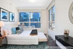 141/361 Kent Street Sydney NSW 2000 Primely located on Kent Street in the heart of the Sydney City is this beautifully presented two bedroom apartment. With an abundance of natural light, with a North East Aspect and positioned nice and high on Level 21, this apartment combines function, space and open plan living to create an inner city sanctuary. This stunning city abode with modern, sleek clean lines, luxurious timber floors throughout is one of the most sought after floorplans in the building.