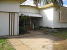 20 KITCHENER ST CLERMONT, QLD 4721 Gosh remember back in the days of She-Ra and He-Man!! With their swords of protection and power, they were indestructible. Reminds me somewhat of this house...indestructible...as solid as a rock!! And not just solidly built either, but a solid layout...three large bedrooms, all with built ins and all along the eastern side of the house. There is a lockable garage at the front along the western side of the house, and alongside this is an additional carport. An awesome entry porch with access to the garage, and lockable storage units invites you into the home. The open plan living & dining areas are in the centre of the house, and are huge, with built in shelving and shadow features. In addition there is the well equipped kitchen with a servery opening onto the dining area. From the dining area, head down a few stairs to the entertaining area. Behind the kitchen is a large storage cupboard and laundry with a ramp down to the clothes line.