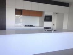 7/33 Parkside Circuit Hamilton QLD 4007 This near new, airy, light filled 3 bedroom, unfurnished home has been finished using high quality materials and designed with space and private areas in mind. Downstairs enjoy the spacious kitchen - a dream for the serious cook - plenty of stone benchtops along with top line appliances - Miele Oven, Gas 5 Burner Cooktop, Microwave and Dishwasher. Be included in family life, while overlooking the open plan living & dining areas, opening out to the private courtyard and garden. Upstairs contains all bedrooms (with built in cupboards), tv/multi purpose room and a walk-in storage cupboard. The main bedroom provides a private retreat, overlooking the river, situated away from the other bedrooms and includes walk in robe and ensuite with shower and a large, deep bath. Separate laundry downstairs contains Bosch washing machine & clothes dryer. Included within the home: a security intercom system; fibre optic broadband; remote control double car garage; clothes line; extensive double window glazing; energy efficient appliances and lighting; smart metering display to monitor your electricity and water usage; 3,000 litre rainwater tank plumbed to the toilets and laundry; automatic external blinds to conserve light and a 3 kilowatt photovoltaic solar system. Hamilton Reach is just 6km from the CBD, located alongside the Royal Queensland Golf Club and within one of Brisbane's largest and most exciting urban renewal precincts - Northshore Hamilton. With no compromise on the good things in life you are in close proximity to a thriving cafe culture, Eat Street Markets, Dendy Cinemas, Racecourse Road and Brisbane City. Northshore Hamilton CityCat Terminal is situated directly out front providing easy transport. This home is a smart choice, if you like the idea of a smaller environmental footprint and a richer quality of urban life - an ideal alternative to apartment living.