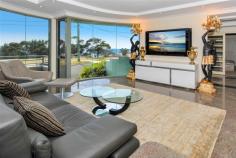 2 Denning St South Coogee NSW 2034 Prime position, opposite parklands and never to be built out ocean and coastline views.
Nothing has been spared in this quality built home that oozes class and
style, from the granite floors to the Waterford crystal chandeliers.
Spanning over three levels, this home was built for the large family with entertaining in mind.
Entry level, with granite tiles throughout the casual and dining areas with direct access to large balcony and amazing views.
Formal and informal living areas, fabulous kitchen, granite bench tops, integrated fridge and loads of storage.
Top level consists of 4 spacious bedrooms, all with built-in robes.
The main bedroom (parents wing) with retreat area, full sized bathroom with spa and double basins and pear wood robes.
A second bathroom accommodates the remaining three bedrooms, laundry shute and walk in linen cupboard.
Lower level, triple garaging, fully tiled, bathroom, sauna and leafy garden complete with pizza oven.