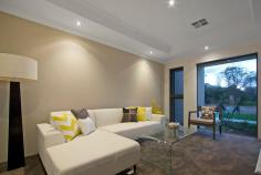 64 Roselea Boulevard, STIRLING 6021, WA This Stunning 2014 completed modern four bedroom,
two bathroom residence is brand new. Nestled on a 599sqm (approx.)
corner block and just footsteps from manicured parklands and lakes in
the fantastic Roselea Estate, this sleek and contemporary abode leaves
nothing for you to do but sit back and enjoy!
Features include, but are not limited to:
- Solid Blackbutt flooring to both the entry and a spacious open-plan
family and dining area with high ceilings and outdoor access to the
entertaining alfresco
- A gourmet chef’s kitchen comprises of sparkling Caesar stone bench
tops, a double sink, tiled splashbacks, a double pantry, a quality
Blanco gas cook top/oven and a breakfast bar for casual meals
- The carpeted front lounge room welcomes you with a recessed ceiling adding a sense of warmth and comfort to the living space
- A parent’s retreat of a master bedroom boasts separate “his and hers”
walk-in wardrobes and a sumptuous ensuite bathroom with Caesar stone
tops, twin vanities, porcelain tiled splashbacks to the shower and its
own toilet
- 2nd bedroom is carpeted with built-in robes
- 3rd/4th bedrooms both have carpets and large WIR’s
- An activity area between the third and fourth minor bedrooms has a
phone connection and Blackbutt timber flooring, making it the ideal
children’s “chill-out” area
- The separate study or office area affords privacy and makes for an ideal quiet work space
- Main bathroom with a separate bath tub, shower and a Caesar stone vanity
- Outdoor power and a gas connection to the paved alfresco entertaining area
- Spacious backyard lawns – plenty of room for a future swimming pool
- Remote-controlled double garage with internal shopper’s entry and access to the rear of property
- Full-length and height built-in linen press to the laundry, as well as a broom cupboard and easy outdoor access
- Separate powder room
- Ducted and zoned reverse-cycle air-conditioning
- NBN ready telephone
- 6 star energy rated
- Feature down lighting throughout
- Reticulation
- Gas hot water system
- Side access to backyard
- Stylish stone feature to facade
- Surrounded by other quality family homes
- Minutes to Stirling station and the freeway
- Close to all amenities, including schools, shopping and more
- Your new life awaits you here