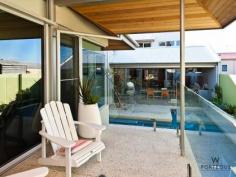 11 Florence St Cottesloe WA 6011 RESORT ELEGANCE AND ENTERTAINERS DELIGHT
This John Lewis designed four bedroom plus gym, three bathroom
spacious home, over three levels is an entertainers dream and everything
a family could want. The elevated 462m2 block is just walking distance
to the beach and all of the spoils of the Cottesloe cafes and shopping
district. Orientated around an azure blue lap pool this show stopping
home is an entertainment retreat divided in to six separate living
zones, four of which connect through commercial stackback glass doors. Exceeding
all lifestyle requirements, it has an openness that flows between two
outdoor kitchens over a modern open plan living space while retaining
excellent separation between all bedrooms. The master suite enjoys a
private balcony and direct access straight in to the pool, as well as a
resort style ensuite bathroom and large walk in wardrobe plus mini-bar. At
the top of a soaring travertine feature wall, the kids have their own
private wing with a spacious lounge area and double size bedrooms all
with built in robes. Guests are not forgotten either with the lower
ground floor dedicated to making their stay enjoyable. Not only do they
have their own bathroom, but they are located right next to the large
walk in wine cellar. The outstanding galley kitchen is custom
designed to provide you with the ultimate cooking experience. As with
everything in this stunning home, only the highest quality appliances
have been selected with the inclusion of Smeg espresso machine,
dishwasher, fridge, upright oven and microwave. If you can prize
yourself away from the amazing kitchen, you can enjoy an outdoor lunch
under the cedar lined patio by the pool or dinner and a sunset beside
the outdoor kitchen at the front. Designed to deliver the ultimate
entertaining lifestyle, this deserving home also offers excellent
separation and privacy for the whole family. -4/5 bedrooms -3 bathrooms plus powder room -Spacious and light open plan dining, living and kitchen area -Modern chefs kitchen with Smeg appliances -Separate upstairs living area with drop down screen and surround sound speaker system -Bright and airy master bedroom wing with its own under cover pool balcony, walk-in robes and resort style bathroom -Elegant stone cladding and large windows, high blade walls and wood lined surfaces, offer the best of everything. -2 separate alfresco entertaining areas. 1 with an outdoor kitchen and 1 with built-in barbecue. -Resort style swimming pool -2 car garage and plenty of storage