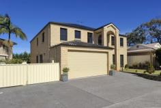 8C Ketch Close Corlette NSW 2315 YOU WON'T BELIEVE YOUR EYES! This amazing home won't last long. Ideal for a large family or even room for the "Nanny". Minimum outdoor maintenance and maximum interior space. Downstairs has superb formal living area, study/5th bedroom, media room and superb kitchen/family room. These open onto the entertainment and pool areas. Upstairs has its own living area which services the 3 king size bedrooms and the master suite. All this and there is still room for boat or van behind the side gated area. Don't miss out on this one!