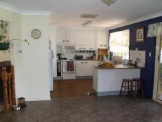 88 Northern Road Roma Qld 4455 This beautifully presented lowset brick home boasts 4 built-in bedrooms, master with walk in robes and ensuite. Modern kitchen with dishwasher and pantry, separate dining and separate living areas, wood heater, ducted air conditioning plus reverse cycle in main. Large tiled bathroom with separate shower and bath. Fully screened with security doors, new floor coverings, new paint work inside, 2 bay lockup garage, paved and covered outdoor entertainment area leading off into the established lawns and gardens. Two rainwater tanks, separate 3m x 3m garden shed and rear yard fully fenced, all this in a flood free area.