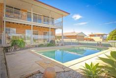 169 Lyons Road Sawtell NSW 2452 Breath Taking Views With breath taking views of Bonville Creek and the Pacific Ocean in the East across Bongil Bongil National Park to the Great Dividing Range to the West this property has a very relaxing setting, luxurious lifestyle and all just moments from Sawtell main street and beaches. Designed over two levels for the extended family, or income earning occupation. Upstairs provides the renovated 2 bedroom, bathroom, living and glorious stone kitchen (complete with sensational 900mm stainless steel gas cooking) all with the most amazing views on offer in Sawtell. The main bedroom is bigger than King size with ocean views, and big built-ins. Solid hardwood polished flooring runs throughout this level. A spacious undercover entertaining deck on this level give you the ultimate lifestyle and overlooks your 11m in-ground salt water pool. Downstairs the living options abound with a further three great sized bedrooms, two bathrooms, two large living spaces, and a second kitchen! All accessible via its own private entrance this downstairs entrance this area could easily become a home business, permanent or student accommodation, or allow your retiring/downsizing family to live within the one home, yet with their own privacy and space, all on ground level.