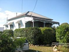 20 Chubb Street, One Mile, QLD Appealing character home. Dwelling features open front verandah, 3
generous bedrooms, formal lounge with pot belly stove, separate dining,
polished floors, 10ft ceilings, modern kitchen with bench space. No
flood. Currently tenanted the home requires maintenance work, which
will greatly enhance the property. Allotment 542m2. Bus transport at
the door. Walk to Primary school and local shops. Ipswich CBD,
university, Riverlink shopping complex some 6-8 minutes away by vehicle.