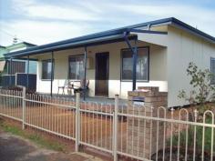 5 Coombes St Collie WA 6225 Reduced: SHORT WALK TO RIVER & CBD SHOPPING 5 Coombes Street, Collie, WA 6225 Situated close to the Collie River and within a short stroll of Collie CBD shopping, is this 4 bedroom plus study/5th bedroom home. Ideal for an astute investor or for a family, this property has many features that include formal dining/family room with log fire and split level air conditioner, gas cooking and Electric hot water service, garden sheds, large block, rear laneway access and so much more.