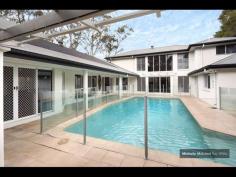 4 GAYNA STREET, KENMORE EXECUTIVE POOLSIDE ENTERTAINER Busy professional families will adore this modern feel and generous size of this special two level residence located in a secluded cul de sac. The convenience, so close to shops, buses, schools and ability to commute north and south of the CBD makes this a perfect family option. Designed with the pool as the central showpiece and loads of glass to capture cross breezes and natural light. With 2 large bedrooms upstairs separated by a breezeway and adjacent to the third bathroom. While the main suite with ensuite and generous walk in robe plus fourth bedroom near the second bathroom is on the ground level. The home office is a superb size and well located. The large lounge and dining can be separated from the other lounge. It also leads out to the poolside patio and looks to the trees on the other side. The beautiful kitchen is exceptionally spacious and has raked ceilings, island bench, rich timber floors and is open to the large family room and casual meals area. There is a private covered deck on one side and more sliding doors leading to the entertaining area with high umbrella. There is loads of storage plus a 3 car lockup garage straight in from the street. Great value and immaculate presentatioD