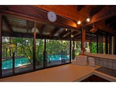 14 Bains Rd Currumbin Valley QLD 4223 Slice Of Heaven
Totally private 4.9 acres of lush rainforest with a 3-4 bedroom
brick & tile home offering slate tile floors and cathedral ceilings
to the living areas, combustion wood fire, bar with bench and sink, all
rooms enjoy spectacular views outside and the living area, dining area,
Master bedroom and 2nd bedroom all enjoy direct access through sliding
doors outside to the beautiful scenery and onto a full length undercover
veranda and a sparkling in-ground swimming pool plus outdoor
entertaining area. The Master bedroom is spacious and has a W.I.R plus
en-suite, there is plenty of storage, near new security screens have
been fitted throughout and there is also the possibility of converting a
huge void in the ceiling to an additional room. There is a veggie
fence, chook pen, feature garden rotunda, double carport (which would
possibly accommodate a small motor home), and a very handy rumpus room
separate to the house. Also offering a 4 bay garage, 2 x 20,000 litre
water tanks, bore water with a pump and a filter and solar hot water.
Enjoy one of the walking tracks and nature.