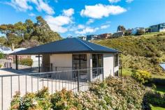 81 Pottery Road Lenah Valley TAS 7008 Ideally located on Pottery Road offering the quiet seclusion and idyllic setting for which this particular enclave is renowned, schools and local services are mere minutes away and this particular property represents outstanding value in relation to the accommodation and features on offer. Deceptively spacious from the street frontage and set over two levels, upstairs offers entry leading to generous open plan living and dining with adjacent deck overlooking backyard, complimented by the striking charcoal kitchen with breakfast bar, pantry and stainless steel appliances. The master bedroom with ensuite and walk in wardrobe also on this level. Accommodation on lower level comprises three further bedrooms, immaculate all white main bathroom with separate shower and bath, plus generous fourth bedroom with deck, which could easily be used as an additional living space for children or teenagers if required. Separate laundry with access outdoors to the delightful rear gardens complete with picturesque creek and vegetables beds, safely fenced for the younger members of the family. Accurately priced to reflect current market conditions, this appealing home certainly deserves an inspection.