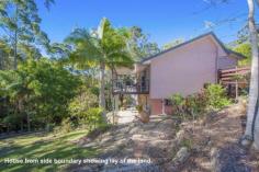 First Choice Property Centre - TAMBORINE MOUNTAIN 12 Jura Court Just you and the birds are here to enjoy this wonderful oasis of peace
and tranquility, backing onto a nature reserve it will never be built
out. You will never want to leave, which is a great possibility as
there is a great space downstairs to work from home. Guest will love
the downstairs fully self-contained area but be careful because grown up
children may never want to leave home!! ~ Split level mountain style home ~ Fabulously high cathedral ceilings in the lounge ~ Glass sliding doors to a large covered rear deck ~ Light flooded living with big windows all round ~ Modern kitchen with plenty of bench space & storage ~ Three bedrooms on the upper level with built in robes ~ Freshly modernised bathroom with separate toilet ~ Down to another spacious lounge room with kitchenette ~ Fourth bedroom with window overlooking garden ~ Shower room downstairs ~ Great additional room with an external door to the driveway ~ Sliding glass doors to a lovely covered patio ~ Easy care gardens leading down to a babbling brook ~ Double carport with space to put in a garage if wanted ~ Fully renovated there really is nothing to do here