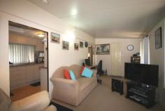 46 Wommin Bay Road Kingscliff NSW 2487 A home for just $68,000 at the Drifters Holiday Village in Kingscliff! This charming home is situated on a large corner block in a very quiet area of the park and features a full width, covered entrance verandah. Open plan kitchen/dining area leading to the bedroom with adjoining lounge. Entry to the bathroom is from the lounge and it consists of shower, wash basin and toilet. The kitchen has a breakfast bar and plenty of storage space with timber-effect laminate doors and light mauve mottle effect bench-tops, complemented with a Westinghouse gas-stove. The home has a paved outside entertaining area, carport and garden shed with laundry facilities. The park has a swimming pool, BBQ area, recreation/games room and the reception is open 7 days a week, sorry no pets permitted