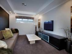 28 Hollington Boulevard Alkimos WA 6038 Built by New Generation Homes, this ex-display home presents as brand
new! Positioned within the Alkimos display village, this home will
impress from it's landscaped front entry through to the timber decked
entertaining area. The kitchen offers stone benchtops, a dishwasher and
lots of cupboard space. A separate dining alcove overlooks the deck with
its automatically controlled water feature and mote. There are two
theatre rooms, one located behind the study and the other in the rear
wing of the property. The design lends itself to dual living spaces,
perfect for those with extended family or long term overseas visitors.
The master bedroom unfolds behind double entry glass doors. A private
verandah is yet another feature. There are two ensuite bathrooms, one at
the front and one at the rear of the property. Ducted reverse cycle
air-conditioning has been fitted. This top of the range system has two
controllers, one for each end of the home. A study overlooks the gardens
to the front and is perfect for those with a home based business. A
massive double garage with internal access is positioned at the rear of
the property. It will accommodate the four wheel drive or the boat.
Quality pelmets, blinds and curtains are all included. The display
furniture was purchased by the current owners and is negotiable on top
of the sale price. Be quick to secure this magnificent home!!