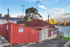 18 Johnston Street Balmain East NSW 2041 Renovator's Delight!!! * Your opportunity to build your dream home!!! * Absolute waterfront * City Skyline views * Best location * Your own beach * Views of Barangaroo, Darling Harbour and the Anzac Bridge * Corner block * Tremendous potential * This will get your creative juices flowing!!! * Potential Boat house/studio/gallery below main house on the water!! * So much potential here. * Corner of Johnston St and William St Please note this is a rundown property in need of work and is without a kitchen, bathroom and bedrooms regardless of icons showing otherwise on some websites.