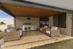 22 Catspaw Ave Beeliar WA 6164 COME FEEL RIGHT AT HOME HERE!! As you walk in the large double door entrance you immediately get that feeling of quality and that you truly are at home. This stunning 4 x 2 family home is situated in the much loved Meve Estate, positioned on the street to capture stunning views of the city and surrounding area. *Large king size master Bedroom with his and her walkin robe, which leads to a great size ensuite. The ensuite is tiled from ceiling to floor and includes large corner spa bath, vanity, shower, IXL light/heat lamps and separate toilet. *Remaining bedrooms are all queen sized with carpet, bedrooms 3 and 4 have stunning views and complete with walk in robes. *Outside entrance features cedar lined ceiling with downlights. *Sunken lounge room with beautiful lighting and carpet. *Separate formal dinning area. *Stunning kitchen with large bench top giving plenty of room for a breakfast bench, lots of cupboards including overhead cupboards, stainless steel appliances including electric oven, gas hot top with range hood, dishwasher, double sinks and large pantry. The shoppers entrance allows for easy access. *Kitchen is part of open planned area, over looking another dining area and 2nd lounge which leads to alfresco area. *Large reverse cycle ducted air conditioner. *Gas bayonet for extra heating is located in the open planned area. *Large linen, big laundry with separate toilet. *Black Butt flooring throughout. *Feature lighting throughout home as well as outside just show the class of this home. *Large paved outdoor entertaining area has cedar lined ceiling with down lights, caf blinds to fully enclose the area and spectacular views. *There is a great patch of grass but the feature of the backyard is the lower decking area and water feature, fantastic for entertaining and finished with a no fuss garden with automatic reticulation. There is also a rear gate for access from the front. *Large double garage with automatic door with extra room for storage. Located near local shops, primary schools, easy public transport and just minutes to both Cockburn Gateways Shopping and Coogee beach this home is a must see.