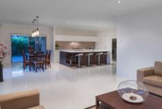 21 Kurura Road Coomera Waters Qld 4209 YOUR DEEPEST DESIRES REALISED!
This distinctive two
storey modern contemporary masterpiece provides the ultimate space for
the modern day family. Both indoor & outdoor activities ha
This distinctive two storey modern contemporary masterpiece
provides the ultimate space for the modern day family. Both indoor &
outdoor activities have been catered for on a grand scale, such as the
83m2 timber decked Alfresco, which is an extension of the everyday
living area & overlooks the sparkling pool. Venture inside for a
special movie in the Media Room, or maybe a game of 8 ball in the Games
Room, or for some special family activity in the upstairs rumpus. There
is a real sense of individuality & spaciousness about this home of
many comforts.
Features & benefits include:-
*The most modern kitchen is an epicurean's delight & includes a butler's pantry.
* The kitchen also boasts Caeser stone bench tops & built-in refrigerated wine rack.
* The everyday family & dining areas have a natural flow to the outdoor Alfresco.
* Huge 33m2 'Games Room' flows to both the outdoor grassed area as well as Alfresco.
* Both the Media Room & Home Office/Study are quietly removed from everyday living.
* Large undercover timber decked Alfresco is highlighted by timber ceiling & lighting.
* Inviting 10metre by 4 metre in-ground saltwater pool will ensure summer fun days.
* Upstairs living incorporates sizeable recreation space & access to private sun deck.
* Master bedroom is most grand & boasts luxury en-suite & amazing dressing room
* Second bedroom is ideal for guests,or teenage daughter, as luxury bathroom adjoins.
* The light filled third & fourth bedrooms are both double sized with built-in robes
* A three car garage has benefit of having drive thru to facilitate parking of Jet-ski
* Ducted air conditioning & ceiling fans in bedrooms provide year round comfort
* Genuine 24 hour mobile security provides peace of mind whether at home or away
* Building size is 575m2 (63 squares) and lot size is 884m2.