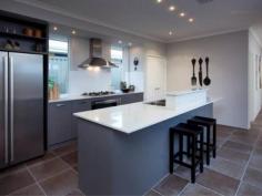28 Hollington Boulevard Alkimos WA 6038 Built by New Generation Homes, this ex-display home presents as brand
new! Positioned within the Alkimos display village, this home will
impress from it's landscaped front entry through to the timber decked
entertaining area. The kitchen offers stone benchtops, a dishwasher and
lots of cupboard space. A separate dining alcove overlooks the deck with
its automatically controlled water feature and mote. There are two
theatre rooms, one located behind the study and the other in the rear
wing of the property. The design lends itself to dual living spaces,
perfect for those with extended family or long term overseas visitors.
The master bedroom unfolds behind double entry glass doors. A private
verandah is yet another feature. There are two ensuite bathrooms, one at
the front and one at the rear of the property. Ducted reverse cycle
air-conditioning has been fitted. This top of the range system has two
controllers, one for each end of the home. A study overlooks the gardens
to the front and is perfect for those with a home based business. A
massive double garage with internal access is positioned at the rear of
the property. It will accommodate the four wheel drive or the boat.
Quality pelmets, blinds and curtains are all included. The display
furniture was purchased by the current owners and is negotiable on top
of the sale price. Be quick to secure this magnificent home!!