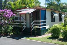 46 Wommin Bay Road Kingscliff NSW 2487 A home for just $68,000 at the Drifters Holiday Village in Kingscliff! This charming home is situated on a large corner block in a very quiet area of the park and features a full width, covered entrance verandah. Open plan kitchen/dining area leading to the bedroom with adjoining lounge. Entry to the bathroom is from the lounge and it consists of shower, wash basin and toilet. The kitchen has a breakfast bar and plenty of storage space with timber-effect laminate doors and light mauve mottle effect bench-tops, complemented with a Westinghouse gas-stove. The home has a paved outside entertaining area, carport and garden shed with laundry facilities. The park has a swimming pool, BBQ area, recreation/games room and the reception is open 7 days a week, sorry no pets permitted