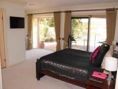 26/40 Cotlew St Southport QLD 4215 The Best Of Lifestyle Choices 4 beds + study/ office, 3 bathrooms, 2 car garage. Once
you enter the security gates of the estate, you will find yourself in a
world removed from the typical hustle and bustle, and the daily grind
on the Gold Coast. Just imagine entering the front door of your prestige
property too relax, overlooking your pool and the expansive waterway at
your rear boundary. This home is filled with quality fixtures and
fittings, a hostess kitchen, and bathrooms to luxuriate yourself in. The
bedrooms are more than ample with built in robes to each. Can't you
just see yourself lazing by the pool or having friends and family over
for entertaining? Life would be great with a fully serviced tennis court
at your finger tips, a sensational way to burn off energy or have fun
with those who are important to you. When it comes to convenience the
best of schools and the shops are only a short distance from your home.
The Gold Coasts Premier night life precinct is close enough to enjoy but
far enough away to not be imposing upon your quiet lifestyle. The
popular Southport Golf Club is accessible from the estate and your only a
short stroll too the Marble bar. Just imagine all this at your finger
tips with the knowledge that you are safe within your fully secured
estate lifestyle. What more could you want for your family and yourself. This property deserves your consideration and you deserve this delightful home. Inspection by appointment is the best way to see all that this home could offer you. Call Ross Busby 0450 271 287