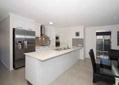 32 Ronaldo Way, Urangan Beautifully designed, this home is perfect for the large or extended family.
Open plan, quality tiled gourmet kitchen, dining and living areas. Caesar stone bench-tops and dishwasher.
Perfect for Queensland living, the entertainment area overlooks a stunning in-ground pool.
Roomy bedrooms have a separate activity room, perfect for the children.
Master bedroom is extra large and has its own en-suite and walk in robe.
Separate games room/student or granny retreat, with a "wet area" bar, bathroom, laundry and study area.
Multi media room air-conditioned by one of three split systems.
Other features: Easy maintenance, large shed at rear, close to schools, and more...