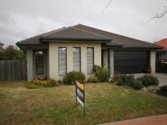 28 Nimbera Street Harrison ACT 2914 This modern home ticks all the boxes. With spacious flowing living areas, fully established, it features a combined lounge/dining area, large family room with backyard access, separate media/rumpus room, 4 bedrooms and 2 bathrooms. The Kitchen is a dream with an island bench providing loads of extra bench space and cupboard space, instant hot water and a huge walk in pantry, gas appliances, dishwasher, glass splash back and stone bench top. All the bedrooms feature mirror robes, the master with an ensuite and walk in robe. There is also a large walk in linen closet for additional storage. Internal access opens into a double garage with automatic doors and an additional walk in storage/utility room. Flowing off the family room and media room is a covered alfresco dining area, offering an indoor/outdoor dining experience for most times of the year. Ducted gas heating and evaporative cooling combines with a sunny northern and easterly aspect to provide year round comfort and amenity as does the tinted windows on the east side of the home. Situated in a quiet loop street, all the hard work has been done. Intelligently designed, this home is ideal for the growing family. Features: •4 bedroom – ensuite with mirror robes and walk in robe off the master bedroom. •Bathrooms come with a lifetime guarantee on the showers. Separate toilet vanity area and a separate laundry with external access. •Internal access to the double garage with automatic doors and external access to backyard. •Modern kitchen with island bench. Stone bench tops, glass splash back with a walk in pantry, gas appliances and dishwasher and instant hot water. •Large family room adjoining the kitchen opens through double sliding doors onto the outdoor terrace. •Media room with built in cabinet. •Ducted gas heating and evaporate cooling with tinted windows on the eastern side of the home. •Attic, workshop/storage and walk in linen cupboard. •Tiled entrance, kitchen and family areas. •NBN and smart TV cabling. •Ducted vacuum system. •Covered alfresco dining area. •Rainwater tank and an electric watering system. •Selection of fruit trees. •Solar efficient home with sunny northern easterly windows. •Crimsafe doors into some entrances. •Down lighting and highlighting in entrance. •Quiet loop street, close to facilities. •Fully established, enclosed backyard with gate access, drying area and rainwater tank.