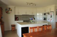 57 Saleyards Rd Millmerran QLD 4357
57 Saleyards Road – Stylish 4 b/r home – Acreage Allotment – $398
000 – Area: 5000 Square metres – This spacious 4 Bedroom brick home
(built Nov 2007), has 4 double sized b/rs, all with built-in storage,
main b/r with large w.i.r. & ensuite with double shower, toilet
& vanity, main bathroom with bath, shower & vanity, separate
toilet, large open plan living area, featuring a very modern kitchen,
with island bench, dishwasher & a large electric stove with ceramic
top. The living area also combines a dining & lounge area with wood
heater & split system a/c, formal lounge, front entry, tiled
undercover outdoor living area, incorporated under the main roof, blinds
on windows on western side, 3 bay lock-up garage, with awning, remote
roller door access, concrete slab, power connected, garden shed, 2 x
5000 gal rain water tanks connected to house, large fenced back yard
with rural outlook, established gardens, automatic sprinklers in lawn
area. This impressive home has built by a local builder, with attention
to detail, leaving nothing to do, except move in.