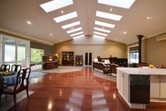 It’s not every day you come across such an impressive, architect
designed, large family oasis, all situated on 3.1 flat usable acres.
As you are welcomed by a circular drive entry your immediate attention
will focus on the semi glaze industrial sized windows which surround the
home with plenty style yet filter so much natural light throughout the
home.
Just to name a few features this property has to offer: 5 bedrooms PLUS
an office, several spacious living with vaulted ceilings, plus a glass
roofed sunroom, air conditioning and fireplaces and a central open
planned kitchen.
20x15m machinery shed with mezzanine storage and heavy lifting
capability. Car parking also extends to a separate 4 car shed.
An outside pool house/gym + covered BBQ area overlooking an in-ground
swimming pool.
Plus the property is also connected to town sewer and town water.
Sure to impress, contact our sales staff for a private inspection of
this home.