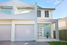 Georges Hall - 31A Denman Road Be
quick to inspect this well appointed 3 bedroom duplex. Conveniently
located close to parks, local schools and shops, this home will surely
impress the fussiest of buyers and is perfect for the growing family. Featuring: Spacious open plan living, dining and kitchen 3 bedrooms, all with built in robes, main with ensite and walk in robe 3 bathrooms White polyurethane kitchen, stainless steel Omega appliances, glass splashback, ceaser stone benchtop Fully tiled throughout - upstairs and downstairs Timber stairs with glass balustrades Ducted air-conditioning throughout Single lock up garage Low maintenance yard For more information please contact Jason Mikhail on 0404 869 870. Please note agent interest in property being marketed for sale.