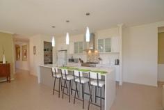 4 Grampian Ct Reedy Creek QLD 4227 37 Square Single Level Designer Home For Sale - $849,000 Ideally
located in the Observatory this sensational five bedroom, three
bathroom single level home is 37 squares and features all the quality
inclusions that one would expect in a display home. The chef's designer
kitchen boasts stone bench tops, quality stainless appliances, a large
island bench, a 900mm gas cook top and a walk in pantry. This
beautiful home offers multiple living areas and will most certainly suit
the growing family that likes to entertain. The five spacious bedrooms
all have built in robes with the master featuring a walk in robe and a
luxurious ensuite with a spa bath. This home boasts three full
bathrooms, a media room, a formal lounge room and an open plan family
room that adjoins a large alfresco dining area that overlooks the
sparkling in ground pool. Ducted reverse cycle air conditioning, a
ducted vacuum system, fly screens and quality window furnishings are all
standard inclusions with this magnificent home which means when you
move in you will have nothing to do and nothing to spend. There is a
grassed area for the kids and pets and the property is fully fenced and
professionally landscaped and most of all it is low maintanence. This is a must see home if you are looking for quality, style and above all location. 5 Spacious Bedrooms – 2 Ensuited 3 Full Bathrooms Chefs Designer Kitchen 3 Living Areas plus Dining Area Media Room Ducted Reverse Cycle Air Ducted Vacuum System Security System In Ground Salt Water Pool Rain Water Tank & Garden Shed Block size is 948sqmts Fully Fenced & Landscaped
