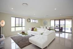 22 Hoffman Drive Marian Qld 4753 This stunning high quality, family home is sure impress. As soon as you enter the home you will notice the high quality fit out, from the water feature at the front entrance, and sandstone tiles on the front porch. The home is fully air-conditioned and security screened and features 4 large built-in bedrooms + study/5th bedroom. The large main bedroom, features a good sized walk-in robe with plenty of hanging and shelving space + beautiful en-suite featuring a double vanity with trendy basins and stone bench top + fully tiled glass free shower with wall recess. Large open plan family and dining with beautiful porcelain tiles and built-in "bamboo" wall feature" + modern island style kitchen featuring, stone bench-tops, stainless steel "Bosch" appliances including dishwasher, trendy pendant lights and walk-in pantry which has built-in cabinetry. Separate carpeted lounge/theatre room. Beautiful main bathroom also with glass free, fully tiled shower with wall recess + modern vanity and bathtub. Good sized laundry and double remote control garage off the house, directly off the kitchen for easy access with the groceries. Living area leads out to the large patio also with beautiful sandstone tiles, perfect for outdoor entertaining + concrete path all the way around the house. Huge 1,00m2 fully fenced allotment with side access to the back yard. Heaps of room for the pool and shed.