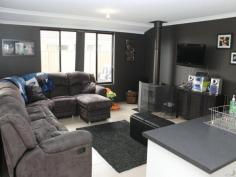 Awesome Rear Living! Feast your eyes on this different design - all the living areas are at the rear of the home to take advantage of family indoor/outdoor living. The main bedroom suite is huge with a great ensuite and walk-in-robe. The 3 minor bedrooms all have built in robes and have an activity room between them. Great for the kids to take over! The spacious open living area is kept cosy with a wood heater and has the well appointed kitchen as its hub. Off this area is the separate theatre/lounge room. The home has ducted evaporative air conditioning through and great decor to suite all tastes. Outside is a wonderful gabled patio that overlooks lush reticulated lawns and gardens, plus a small garden shed. Drive straight through the double garage for access to the backyard. There's also extra parking on the front verge. This home is in a great location and only a short walk or ride to Kingston Primary. Be quick to view this easy care family home! Call Darryl Helms at DAD Realty to book an inspection.