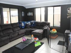 Awesome Rear Living! Feast your eyes on this different design - all the living areas are at the rear of the home to take advantage of family indoor/outdoor living. The main bedroom suite is huge with a great ensuite and walk-in-robe. The 3 minor bedrooms all have built in robes and have an activity room between them. Great for the kids to take over! The spacious open living area is kept cosy with a wood heater and has the well appointed kitchen as its hub. Off this area is the separate theatre/lounge room. The home has ducted evaporative air conditioning through and great decor to suite all tastes. Outside is a wonderful gabled patio that overlooks lush reticulated lawns and gardens, plus a small garden shed. Drive straight through the double garage for access to the backyard. There's also extra parking on the front verge. This home is in a great location and only a short walk or ride to Kingston Primary. Be quick to view this easy care family home! Call Darryl Helms at DAD Realty to book an inspection. View Sold Properties for this Location View Auction Results
