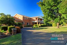9 Terrigal Crescent O'Malley ACT 2606 Unparalleled in grandeur, this expansive eight bedroom, eight bathroom, three storey residence on a vast 2106m2 block, presents living on the most majestic of scales. Located in one of Canberra's most exclusive and luxurious suburbs, only moments from all major amenities yet set peacefully apart from the noise of major motorways, this property is a testament to the magnificent character of O'Malley. Until recently, this solid red brick home, built to the highest of standards and comprised of flowing and substantial living spaces, has been used as an embassy. Always maintained with the upmost of care, the circular front drive bordered by lush sculpted gardens makes way for the impressive redbrick facade of this beautiful home. Entering through double doors into the large foyer, you are greeted on the right and left by parallel staircases leading alternatively to the lower or upper levels. Ahead, as the centerpiece of the home, awaits a living room with an open fireplace and ceilings rising two generous storeys. The extensive entertaining areas of this home also include a huge dining room with an open fireplace, billiards room with bar and bathroom, family room leading to the enormous open ash wood and granite kitchen and casual dining area with ample storage, an immense undercover outdoor entertaining area, a green and private rear yard, and an indoor solar-heated saltwater pool. As well as the eight bedrooms, four of which have ensuites, this elaborate home also offers a flat on the lower level with its own kitchen and bathroom. The lower level also includes an oversized nine-car garage and a large storage area. Three of the bathrooms in the house feature corner spas, with one also featuring an authentic wood sauna. Other design features and creature comforts of the home include high-ceilings, an extensive use of glass leading to the outdoor entertaining areas, balcony off the master bedroom, ash timber ceilings, ducted vacuum, and reverse-cycle air conditioning. Ideal for an ambassadorial residence, an embassy or for a large or an extended family.