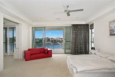 1008 Edgecliff Drive Sanctuary Cove QLD 4212 - 4 ensuited bedrooms, including guest bedroom downstairs - 5th bedroom adjoining master suite - perfect as nursery, parents retreat or hobby room - Master suite boasts huge bedroom, ensuite with double sinks, shower with doubles shower heads, bath and walk-in robe with cabinetry, adjoining office with built-in desks and cabinetry, and balcony with water views - Great kitchen with curved stone benchtops, loads of storage, inbuilt wine fridge, high end appliances including built-in steamer, oven and grill, and microwave - Kitchen also features fabulous butlers pantry with dishwasher, sink and server - Open plan living flowing from kitchen and looking out to waterfront - Desirable North-to-Water position - Sweeping harbour front views - Formal dining on raised circular platform with polished timber floor, featuring spectacular chandelier - Media room with dark plush carpet - Floor-to-ceiling glass sliding doors along whole back of house - doors regress completely into wall for true seamless indoor/outdoor living - Awesome outdoor entertaining area overlooking the waterfront, with built-in bench with sink, BBQ and rangehood, and storage - Open-air sundeck on waterfront - Inground tiled pool with glass fencing - Floating pontoon with power, light and water - Ducted air conditioning - Home automation system - Bedrooms all screened with ceiling fans - 3 bedrooms feature walk-in robes, 4th bedroom with built-in robes This impressive home is located in the prestigious secure estate of Sanctuary Cove. With 24 hour security, and premium facilities such as members only golf club, rec club and gym and world-class golf courses, you will love living here. Enjoy the buggy lifestyle with easy access to the shops and restaurants in the Sanctuary Cove Village.