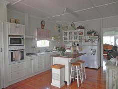 82 Atthow St Kilcoy QLD 4515 This beautiful 3 bedroom weatherboard home is situated in one of Kilcoys
best positions. Close to the Golf course and hospital and perched up
high enough to take in the glorious mountain views and catch the cooling
afternoon breezes.
The home itself has a wonderful warm feel about it and has been
lovingly and thoughtfully renovated to recreate the cosy feel of
yesteryear. The kitchen is a chefs delight with plenty of bench space,
and a gas cook top. The adjoining dining room is airy and spacious and
opens onto the deck which is perfect for entertaining. A private roomy
lounge and two good sized bedrooms (both with built ins) and bathroom
complete the upstairs. The upper level of the home features gleaming
polished timber floors. Down stairs is the third bedroom with ensuite (
perfect for the teenager or elderly parents), laundry and room for
entertaining and car accommodation.
The home sits on a 993 sq mtr corner block is partially fenced and has low maintenance gardens.