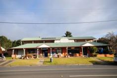 91 Hoddle Street Robertson NSW 2577 Web ID : 1667004 Price : $950,000 WIWO Property Type : House Sale : Private Treaty Land Size : 1226 Sqms Investment Opportunity! 6 2 2 Zoned B2 Local Centre constructed of brick and timber with an iron roof. Presently a General Store/Newsagency and small Gift Shop. Above the General Store/Newsagency - 2 bedroom flat with living area, kitchen and bathroom. The Gift Shop with smaller shop front features a 4 bedroom flat behind and above. Consisting of large lounge room, kitchen, laundry and utility room below and upstairs four bedrooms, bathroom and separate w/c and a wide balcony across the upstairs section. Verandah at street level, tandem style double garage (drive through). Back yard with access from laneway (at present access not legal is via the hotel adjoining driveway).