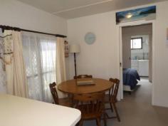 N4 White Albatross Nambucca Heads NSW 2448 Entry to this home is via a glass sliding door from a private front verandah, located in the White Albatross Over 50's Park at the entrance of the beautiful Nambucca River. A fresh feel to the lounge room on entry has glass mirrored tiles giving length to the room. The lounge and dining with new carpet underfoot flows through to the kitchen, with the added comfort of air conditioning. The kitchen with new timber look a like vinyl flooring, comprises of electric upright cooker and range hood. Adjacent to the lounge is the 2nd bedroom with glass sliding doors to a back verandah. This room also has direct access to the bathroom as does the main bedroom. Leading from the dining room, with new carpet and mirrored built in robes is the main bedroom. The bathroom come laundry, has a toilet, vanity, shower and linen cupboard. There is convenient room for a washing machine within this area. Externally the property has a single carport, with paving to the rear. A covered back verandah has shade cloth blinds and a great area to hang washing on a rainy day. Step down to a delightfully maintained lawn area with bush further a field, this outlook is definitely a feature of the property.