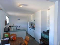 10 Impey Ave Tin Can Bay QLD 4580 The price has just been dropped on this 'NOT TO BE MISSED" opportunity to purchase a house (it is two separate units at the moment) at an unbelievably low price!! At the moment the property is used as two units, the upstairs unit has three bedrooms, and the downstairs unit has two bedrooms. Both units are in need of renovation to bring them up-to-date. Presently they are rented out at $185/week upstairs and $175/week downstairs. If renovated you could bring the rents up to say $220/week upstairs and $200/week downstairs. Location is superb - one street back from the beautiful Tin Can Bay foreshore. If you didn't want to keep them as units the property would make an excellent family holiday home. These opportunities don't come along very often - call Janet TODAY!! Features Fenced Safety Switch Outdoor entertainment area Smoke Alarms Property Details Bedrooms 5 Bathrooms 2 Car Ports 2 Contact Details Agent: Janet Young Mobile: 0438 587 239