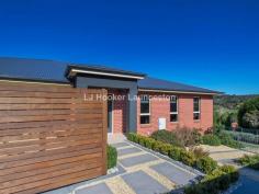 6/14 New Ecclestone Road Riverside TAS 7250 What an opportunity! This immaculate, on trend residence has been designed and built to the highest quality whilst still providing practicality and functionality. An amazing layout with features that are rarely found in Launceston real estate you will adore this property and all it has to offer. Spread over approximately 30 squares of quality living, enjoy features including: Three living areas, gourmet family friendly kitchen complete with a full butlers pantry, 4 large bedrooms all with built ins and the master suite has a large walk in robe and ensuite bathroom. Read more at http://launceston.ljhooker.com.au/1Q28GND?play=1#Qm7giBCz6RYxmwfb.99