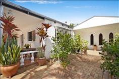 15 Sunset Blvd Tweed Heads West NSW 2485 Deep Water Frontage - Family Entertainer If
you're looking for space then this home is for you; offering four
bedroom single level brick and tile home with two living areas plus
sunroom this home has options for the whole family. Entry to this home
is via intercom and electric gate to ensure you family are always safe
and secure. Through the covered entry way you enter the spacious living
area which features parquetry flooring and large built in buffet for all
your storage needs. The modern kitchen services this area well and
features granite benches, new electric wall oven, large walk in pantry
with automatic light and ASKO dishwasher. This space flows effortless
through to the sunroom area which boasts floor to ceiling glass and
takes in stunning water views and offers an in-ground spa for you to
relax and watch the life on the water pass you by. There is a lovely
outdoor terrace which is accessed both from the sunroom and the dining
area; it is paved and features established small fruit trees. The
bedrooms are all accessed by a main hallway which runs past the entry
foyer. To one end there is a rumpus room which is spacious enough for a
billiards table and provides internal access to the double garage. The
garage is oversize and features laundry space and access to the paved
courtyard; plus there is a double undercover carport at the front of the
home. All bedrooms are large enough to fit queen beds and feature built
in robes; the main bathroom is located with the bedrooms and offers
separate bath, glass encased shower and separate toilet. The master
bedroom is very spacious with views over the water and offers walk in
robe and currently utilises one of the bedrooms as a dressing room. The
ensuite is well appointed with glass encased shower, floor to ceiling
tiles and tidy vanity. This home offers buyers a lifestyle choice with
the waterfront offering options for the whole family to enjoy including
deep water frontage with access to the ocean for the boating enthusiast,
sandy beach for the kids to play and views for miles to sit and unwind
after a long day. Other features of this home include solar hot water
system and ducted air conditioning throughout. Positioned only a minutes
drive to Seagulls Club, with bars, restaurants and gym and three
minutes to the M1, five minutes to Coolangatta Airport and Southern
Cross University this is the ideal position for the busy family life. Property Features & Amenities General Features Property Type: Residential Bedrooms: 4 Bathrooms: 2 Parking: 4 Other Features Air Con