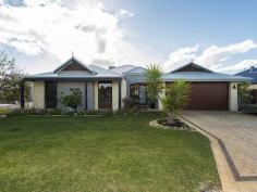 49 Pavilion Circle The Vines WA 6069 Your only local Real Estate Office, The Vines Real Estate offers the following quality home in a great location For Sale. Immaculately presented 3 bedroom 2 bathroom home backing onto the golf course and with only one adjoining neighbour offers a haven of serenity, style and privacy in an exclusive location. This is your opportunity to live in a quiet and secure area within strolling distance to The Vines Resort & Country Club. If you are looking to downsize in size but not quality, then you need to view this superb home. Theatre/TV room (easily converted to 4 th bedroom if required) Wide foyer flows through to open plan living area with high 31c ceilings Main sitting area with built in gas fire place overlooks private side garden and opens to alfresco living Well appointed kitchen has abundance of cupboard and bench space, walk in pantry, s/steel appliances and views to rear Dining area opens to alfresco living under the main roof Delightful private king size master bedroom at the rear of the home with its own security door to outdoor garden and sitting area The master ensuite has double vanity, shower, corner bath and separate toilet 2 nd bedroom is also king size and has a built in robe 3 rd bedroom is queen size and has a built in robe Both minor bedrooms face the front with garden views and are serviced by the main bathroom and separate toilet/guest powder room Laundry with ample 3 door sliding linen and broom cupboard The stunning outdoor is a green haven with lawn and hedging giving it total privacy whilst maintaining views to the golf course and lake in the distance Double remote controlled garage has rear roller access, extra storage space and shoppers entrance to house Solar gas boosted hot water system, ducted air conditioning, 3 phase power, monitored alarm system, smart wiring Beautifully maintained gardens and lawn reticulated from mains Land area – 491sqm corner lot For further details please contact PAM MITCHELL from The Vines Real Estate all hours on 0407 192 792 – YOUR DEDICATED VINES PROPERTY SPECIALIST – SERVICING YOUR IMMEDIATE AREA – DELIVERING PREMIUM RESULTS – LIVING AND WORKING LOCALLY