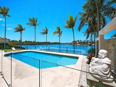 5713 Anchorage Terrace Sanctuary Cove QLD 4212 Pristine Refurbished Waterfront - Prime Location This luxurious single level residence is within the most prestigious waterfront area within Sanctuary Cove and enjoys the widest river expanse with a North to North East aspect. Fully gated and completely refurbished to an exceptional standard; it has spectacular vista to the main river. Sprawled across 1375m2 of prime land with a north easterly aspect, the interior of the home is spectacular and stylish but also offers a relaxed atmosphere where the water is visible from all indoor living areas. No expense has been spared on the interior of this delightful property which includes: *Formal entrance with chandelier *Sumptuous master suite with a stunning ensuite and dual walk in robe *2 king size bedroom suites set apart from the master *Gentleman's study with own access (could be a media room) *Stunning guest powder room *Kitchen with uninterrupted water vista *Concealed temperature controlled wine storage room *Concealed bar *Lounge and living area overlooking the river *Large fully fenced resort style pool on the water's edge. *Mooring to accommodate a very large boat *Easy care lawn and garden General Features Property Type: House Bedrooms: 3 Bathrooms: 4 Indoor Features Ensuite: 3 Living Areas: 2 Toilets: 4 Alarm System Indoor Spa Study Floorboards Broadband Internet Available Built-in Wardrobes Dishwasher Ducted Vacuum System Ducted Heating Ducted Cooling Outdoor Features Remote Garage Secure Parking Garage Spaces: 3 Open Car Spaces: 4 Courtyard Outdoor Entertaining Area Fully Fenced Swimming Pool - Inground