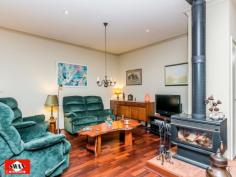 23 Walden Close Gidgegannup WA 6083 Inspections Inspections by appointment only. This rural and much sought after village on the edge of metropolitan Perth, has many superb life styles to offer. This 6.2 acre property would have to be classified as your own piece of paradise, secluded and far away from the maddening crowd with the hustle bustle of the city. It borders other large properties with one great neighbour, Please allow me to give you a little tour, starting with pines and an electric gate/intercom, a welcoming feature on wet and windy days. The 150 metre trees and shrubs lined driveway brings you to a large parking area, a double car port and double shaded parking. A lovely elevated home, flanked by bush further compliments this great setting. The pond, the sound of 3 waterfalls, lush green rockery and a backdrop of unique and unusual panels, gives the outdoor entertaining area a special feel. Open living with 180 degrees views over a native garden, bushes and trees that seem to ramble on into the distance over this gently sloping property. The split kitchen is a cook’s dream where dirty dishes and evidence of a great meal are hidden from view by a low curved feature wall. It also features a new gas cook top, electric oven. The property boasts a large master bedroom with private ensuite and walk-in-robe as well as a large double guest bedroom and a smaller double bedroom both with built-in-robes. There is also a office/single bedroom overlooking this amazing property. The main bathroom is large and is beautifully presented with a spa/shower and toilet. The pristine jarrah flooring flows through the home and along an extra wide passage way with bookcase. The high ceilings, tinted windows throughout and the cosy wood fire resonate the perfect setting to unwind and enjoy the stunning views from this beautiful property whilst reading, relaxing with family or entertaining. A solar hot water system with gas booster and a solar tracker run endless hot water to the property using the sun hitting the large roof span to reduce your electricity costs. Outside the property features a wrap-around verandah for relaxing and taking in the breathtaking sunsets. The property is also fire ready with permanent gutter guard, 24m span large sprinklers, extra-large electric cable, firefighting pump and hose and 12000L and 150000L water tanks. Hundreds of graceful grass trees (black boys) some ancient surround the home, together with the many shrubs and trees that make this property lush and green all year round. A small path meanders through the bush to a netted vegetable garden, 2 open patches and a 6m x 3m potting shed with electricity. Next to this is a 12000L water tank fed by a 600 gallon an hour bore for watering with a new pump. Currently three quarters of the property is reticulated with automated sprinklers and a float switch regulates the water level. There is another 6m x 3m workshop also with electricity, a work bench and shelving on both sides for storage. Then there is a 6m x 3m ventilated storage shed. Just down a slope your eye will catch citrus and exotic fruit trees as well as 2 almonds, and a pecan tree, all artistically netted and weed protected by a weed matt and top dressed with very fine gravel. Further down a chicken coop, enclosed to make it fox proof and house on stilts, with easy access to eggs. This is part of a larger open enclosure, ideal for geese, ducks, goats etc. A circular driveway leads to steps and a 150.000 Lt. rain-water tank that sits on the other side of the house together with more netted exotic fruit like, Jube-Jube , Persimmon, Pawpaw, Pomegranate and another Shartoot all hidden from view. Jezzabelle the pet kangaroo was brought up in the house and considers this her home. She will delight you when she comes to feed with her current joey. Wild ones will come down in the hot summer to feed at the kangaroo patch just below the house which is kept green with two large sprinklers. There are several great secluded spots to sit with a book overlooking a dam across the bridle path or you might
enjoy the green rolling pastures across the fire break. Close to the house is a great spot for a fixture or an umbrella and some chairs, marvelling at the lovely view, bush orchids and wild flowers. This area is ideal for entertaining with friends or family. There is ample room for a pool or to keep animals. The local schools at Mt Helena are only a few kilometres away and there is a bus stop 100 metres from the front gate of the property. • If you are ready to make the tree change and looking for seclusion and nature at its best, waking up to the sound of kookaburra’s. • If you marvel at the sight of an eagle soaring high in a clear blue sky or watch a flock of red tailed cockatoo’s resting in their favourite tree. • If you like to be surprised by a bobtail wondering past or like to surprise a sleeping sun drenched goanna on the driveway. • If you like to spot an unsuspecting bandicoot or get excited by a heron, gingerly negotiating rocks to snatch a fish from the pond. • If you enjoy watching galas, twenty eights and magpies or beautiful bright blue wrens all vying for position at the feeder just outside the window. THEN THIS CAN ALL BE YOUR INSTANT PRIDE AND JOY. The owners have lovingly spent many years of dedication to this once virgin piece of land which has so much to offer that no photo or description would do justice to the magic that surrounds you here.
