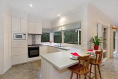 32 Wandarra Way Warranwood VIC 3134 4333Price Guide: More than $670,000 | Land: 652 sqm approx | Type: House | ID #111891 Barry Plant Ringwood T 03 9870 5555 EMAIL OFFICE Nicole Freene T 03 9870 5555 | M 0448 877 387 EMAIL AGENT Aaron Chuah T 03 9870 5555 | M 0408 828 000 EMAIL AGENT Details Map/Directions Area profile Carefully Designed To Offer The Ultimate Family Lifestyle From its quiet cul de sac location to the carefully planned two-storey floorplan, much thought has gone into creating this gem of a home that truly offers the ultimate family lifestyle. Careful consideration has gone into every aspect of this home to ensure its durability for everyday family living and ability to entertain on a very grand scale. It's therefore no surprise to note that large families are comfortably catered for within this space-laden home, which boasts three separate living areas along with a magnificent entertaining terrace that's virtually another room in itself! The home's grand persona is portrayed in the flowing sense of space shared by each of its radiant living areas, which maximise space and suited for a host of living requirements. Evoking the charm of a country lifestyle with its leafy surrounds and tranquil ambience, leadlight windows adorning the top of large, frameless windows are definitely in keeping with the home's period-inspired theme. Grand open-plan living with a large, well-appointed kitchen and family living with wood combustion fireplace makes for a superb centrepiece and combines with the spectacular wrap around deck that floats amongst the treetops, delivering the perfect indoor-outdoor entertaining set-up or peaceful sanctuary for that afternoon escape. While on the topic of peaceful sanctuaries, the light-filled formal lounge (with adjacent dining) frames pleasant front garden views as you unwind with a book in hand; teenagers, meanwhile, have a downstairs retreat to call their own. And with its own entrance, access to a large bedroom (with built-in robes) and brand new bathroom facilities on hand, it's also dressed with the flexibility of multi-generational living. Bedrooms of generous proportions delight with their comfort and space, while a huge amount of storage in and around the home promotes clutter-free living. Finished with gas ducted heating plus split-system heating and cooling and boasting a family-friendly location within excellent access of well-regarded private schools, scenic parkland, Eastland Shopping Centre and Eastlink