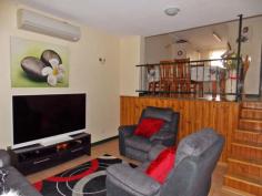 7/4 Aneura Pl Sadadeen NT 0870 Situated in the Sadadeen area close to schools, shops and transport is this end three level townhouse. The unit is almost at the top of the block with fabulous views of the surrounding areas and MacDonnel Ranges. Entry is to the front verandah which can double as a 2nd outdoor living area. The lounge area is tiled, boasts a reverse cycle air conditioner and has a handy storage area under the stairwell. The spacious second level area is tiled with the kitchen having electric cooking, dishwasher and ample cupboard and bench top space. The internal laundry is on this level as well and also a second toilet. Up the stairs to the top level you will find two bedrooms both with carpet and built in wardrobes. The main bathroom has shower over bath, vanity and toilet inclusive. Your private courtyard is paved and has a lovely shaded timber pergola and there is a side gate that allows you access to your unit from the side.