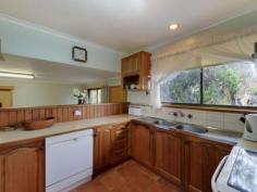 913 Oceana Dr Tranmere TAS 7018 Whale Of a Time Near the Water Land area: Approx 150m2 inc garage/workshop Land area: Approx 880m2 Offers around $415,000 SWEEPING views across the River Derwent to the city and Mt Wellington enhance this well presented, split-level family home with lovely mature gardens. Designed to maximize the outlook and sun through the day, the home is located in an established, harbour-side suburb on Hobart's eastern shore. The good sized block is very gently sloping with a cement driveway down to the under-house garage/workshop with a roller door and a single carport before the rear garden with its veggie plot and glass-house. A side porch-way provides access to a foyer with a terra cotta tile floor and a sliding door to the bright lounge with a Daikin air conditioner and the delightful views across the sparkling blue river. Adjoining is a dining area with a sliding door to a cosy sunroom and adjacent sundeck with harbour views. Also off the dining area is a functional Blackwood kitchen with good bench and cupboard space and including an upright stove with a ceramic cook-top and oven/grill, a stainless steel range-hood and there's a dishwasher. Two steps down is a family room with a storage heater and then a short hallway with a panel heater and linen press before three bedrooms with built-in storage and the master also having an en suite bathroom. The family bathroom is nearby and includes a toilet, while the laundry, with another handy loo off, is located to the rear of the garage and there also is good under-house storage. The property is close to transport and is about a10 minute drive from the schools, shops and other services at Howrah while the city centre is about 20 minutes by car. There are pleasant river-side walks in the area while yachts and other river traffic, porpoises and very occasionally whales provide an entertaining outlook from the living areas and deck. Property Snapshot Property Type: House Aspect Views: Harbour, City and Mountain Views House Size: 150.00 m2 Land Area: 880 m2 Features: Decking