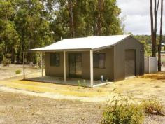 17 Cockatoo Drive Nannup WA 6275 Inspection by Appointment TREED BLOCK WITH WEEKENDER SHED Backing onto state forest in Cockatoo Valley, just under 5 km south of Nannup town site, this natural jarrah and marri 4 acre block with weekender shed is just yours for the taking. Whether you want to build your new home among the trees or just enjoy a rest from the city or plan for your retirement. The property is at the back of a small sought after estate called ‘Cockatoo Valley’ just on the outskirts to the south of the Nannup township and is surrounded by state forest. The brand new powered shed has a shower and toilet and is ready for you to make it into a comfy weekender or to stay in while you build your new home. Verandah to the back with shed windows and large glass sliding doors so you can sit out and look out onto the trees and birdlife. The 4 acre property is narrow at the road and widens out towards the state forest so there is 144m width at the state forest side. Absolutely lovely shaped block with a huge building envelope and with neighbouring houses already in situ it makes it an easy decision where to place your new home. Power, septics, rainwater tank and hot water system installed