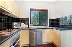 21 Mugga Way Tweed Heads NSW 2485 Leafy Tweed Cottage in Great Location Situated
on a corner block just a 300m walk to the waterfront canals of Tweed
Heads is this charming three bedroom cottage which will suit those
looking to add their own touches. The living space is open and features a
bay window which takes in the leafy views of Dock Island. There is a
dining space is just off the kitchen which opens to the rear deck -
Ideal for summer BBQ's and family functions. A modern and well-appointed
kitchen will suit the fussiest of home cooks, with stainless steel
appliances and electric cooking plus space for a large fridge. Just off
the kitchen you have access to a separate internal laundry which opens
onto the sunny rear deck. Three spacious bedrooms feature built in
robes; the main bedroom with its own access to a small balcony at the
front of the home. The neat bathroom is located close to bedroom two and
three with modern vanity and glass shower door. On the lower level you
will find a single car space, with plenty of under house storage space
where you can easily transform into a workshop area for the home handy
man. The concreted driveway provides plenty of space for off street
parking for additional vehicles. This is a wonderful opportunity to take
advantage of the lifestyle that is on offer here. We welcome your call
to inspect this property to really appreciate the potential and
lifestyle it offers. Property Features & Amenities General Features Property Type: Residential Bedrooms: 3 Bathrooms: 1 Parking: 1